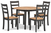 Ashley Furniture Gesthaven dining room set with a wooden table and matching chairs, shown from an angled side view.