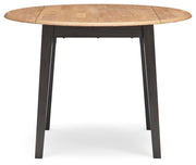 Ashley Furniture Gesthaven dining room set with a wooden table and matching chairs, shown from a head-on angle.