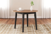 Ashley Furniture Gesthaven dining room set with a wooden table and six matching chairs in a classic design.