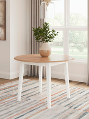 Ashley Furniture Gesthaven dining room set with a wooden table and six upholstered chairs in a classic design.