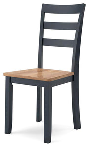 Ashley Furniture Gesthaven dining room set with a wooden table and six upholstered chairs, shown from an angled view.