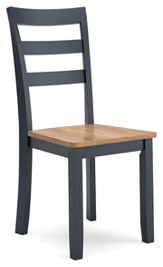 Ashley Furniture Gesthaven dining room set with a wooden table and six matching chairs, shown from an angled side view.