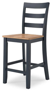 Ashley Furniture Gesthaven dining room set with a wooden table and six upholstered chairs, shown from an angled view.