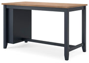 Ashley Furniture Gesthaven dining room set with a rectangular table and six upholstered chairs, viewed from an angle.