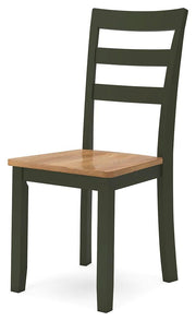 Ashley Furniture Gesthaven dining room set with a wooden table and six matching chairs, shown from an angled perspective.
