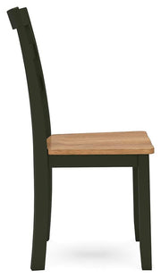 Ashley Furniture Gesthaven dining room set with a wooden table and matching chairs, shown from a side angle.