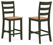 Ashley Furniture Gesthaven dining room set with a wooden table and six upholstered chairs, shown from a side angle.