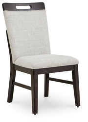 Ashley Furniture Neymorton dining room set with a wooden table and matching chairs, shown from an angled view.