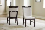 Ashley Furniture Neymorton dining room set with a wooden table and six upholstered chairs, showcasing a classic dining room design.