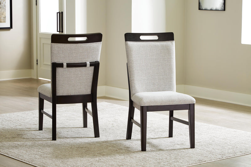 Ashley Furniture Neymorton dining room set with a wooden table and six upholstered chairs, showcasing a classic dining room design.