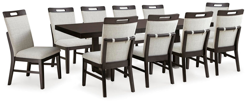 Ashley Furniture Neymorton dining room set with a rectangular table and six upholstered chairs, shown in a modern dining space.