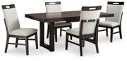Ashley Furniture Neymorton dining room set with a wooden table and matching chairs, shown in a modern dining space.