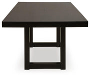 Ashley Furniture Neymorton dining room set with a wooden table and six upholstered chairs, shown in a modern dining space.