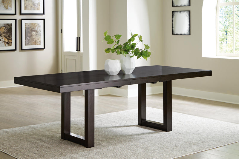 Ashley Furniture Neymorton dining room set with a wooden table and six matching chairs, featuring a classic design.