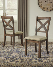 Ashley Furniture Moriville counter height dining set with wooden table and matching chairs in a modern dining room setting.