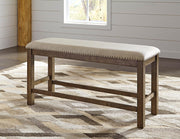 Ashley Furniture Moriville counter height dining set with table and four chairs in a modern dining room scene.