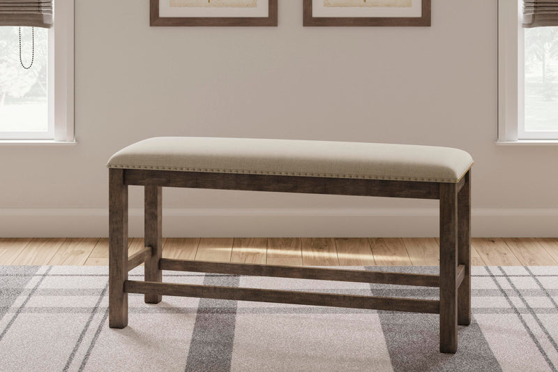 Ashley Furniture Moriville counter height dining set with four chairs and a rectangular table in a modern dining room setting.