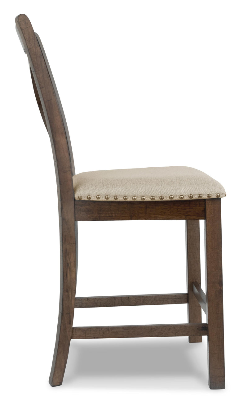Ashley Furniture Moriville counter height dining set with a rectangular table and four chairs, wood finish, in a modern dining room.