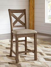 Moriville counter height dining set by Ashley Furniture with a wooden table and matching chairs, ideal for modern dining rooms.