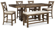 Ashley Furniture Moriville counter height dining set with a wooden table and matching chairs in a modern dining room.