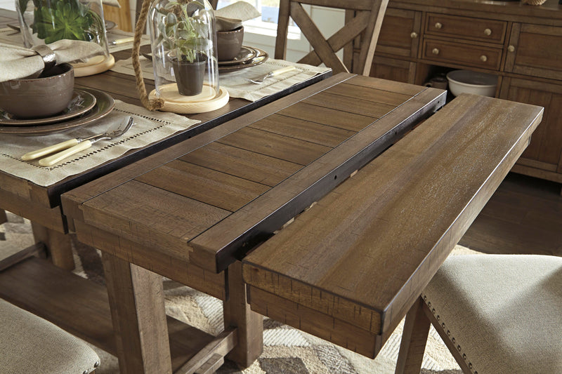 Ashley Furniture Moriville counter height dining set with a table and chairs in a modern dining room setting.