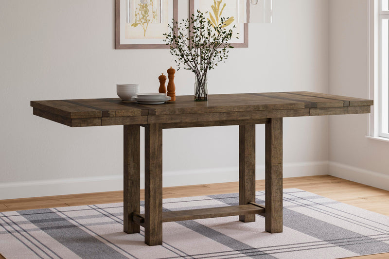 Ashley Furniture Moriville counter height dining set with a wooden table and matching chairs, in a warm brown finish.