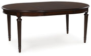 Ashley Furniture Lavinton Dining Package featuring a stylish dining room set with a leaf-shaped table and matching chairs.