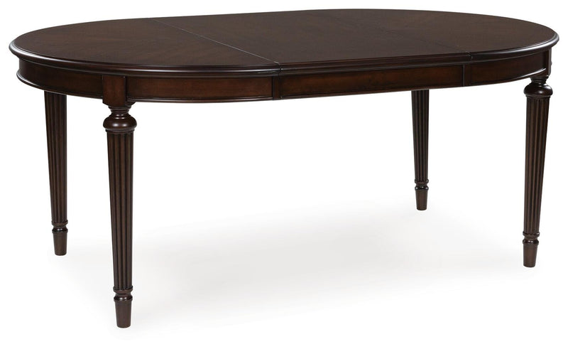 Ashley Furniture Lavinton Dining Package featuring a stylish dining room set with a leaf-shaped table and matching chairs.