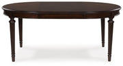 Ashley Furniture Lavinton dining room set with a table and leaf extension, featuring elegant wood finish and matching chairs.