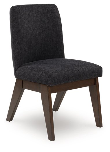 Ashley Furniture Dilenno dining chair with upholstered seat and wooden legs, shown from an angled side view.