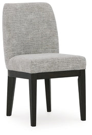 Ashley Furniture Burkhaus dining room set featuring a wooden table and matching chairs, shown from an angled side view.