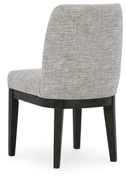 Ashley Furniture Burkhaus dining room set, image showing the back view of the dining table and matching chairs in a modern design.
