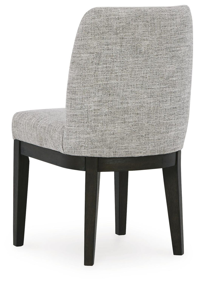 Ashley Furniture Burkhaus dining room set, image showing the back view of the dining table and matching chairs in a modern design.