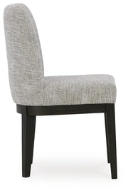 Ashley Furniture Burkhaus dining room set with a wooden table and matching chairs, shown from a side angle.