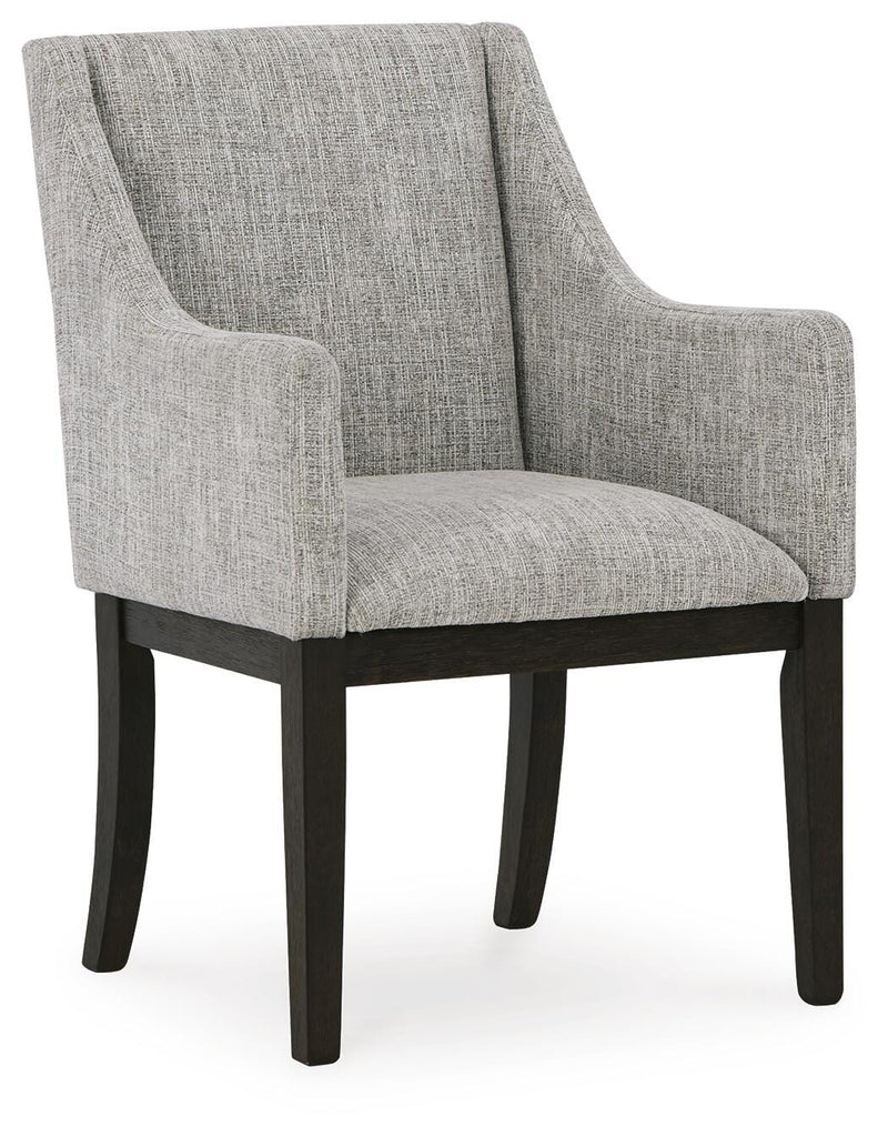 Ashley Furniture Burkhaus dining room set with a wooden table and six upholstered chairs, shown from an angled view.