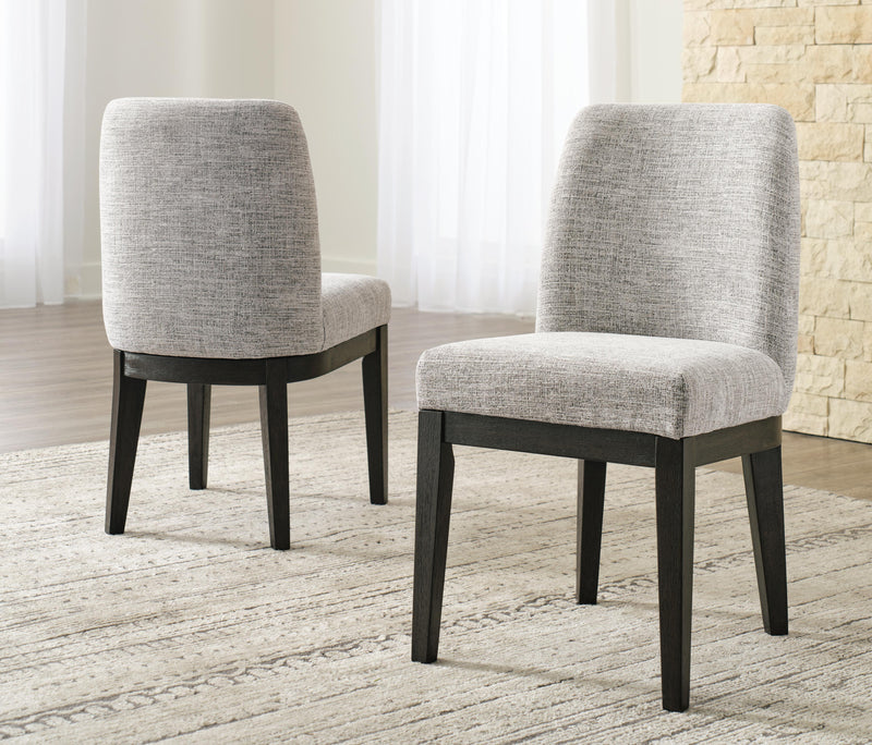 Ashley Furniture Burkhaus dining room set with a wooden table and matching chairs in a modern design.
