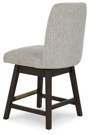 Ashley Furniture Burkhaus dining room set with a wooden table and matching chairs, shown from an angled back view.