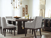 Ashley Furniture Burkhaus dining room set with a wooden table and six upholstered chairs in a modern dining space.