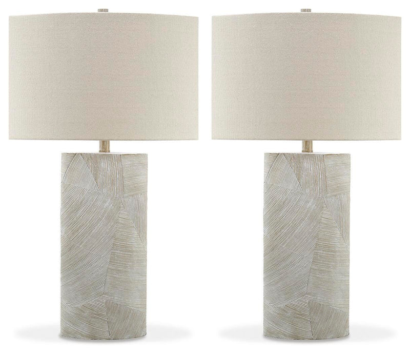 Ashley Furniture Bradard Lamp Set featuring two stylish table lamps with beige fabric shades and wooden bases on a modern side table.