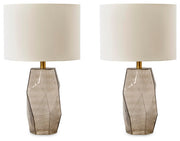 Ashley Furniture Taylor Lamp Set featuring two stylish table lamps with neutral fabric shades and wooden bases.