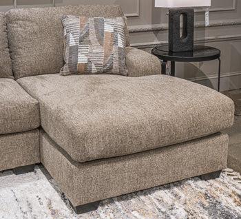 Ashley Furniture Seyler Lane sectional with chaise, showcasing a modern fabric sofa with a spacious chaise lounge.