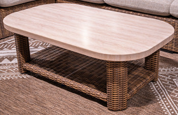 Dolan Creek outdoor cocktail table by Ashley Furniture, round wooden outdoor coffee table with slatted design and sturdy legs.
