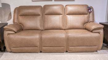 Ashley Furniture Glencroft power reclining sofa with plush cushions and reclining features, shown in a spacious living room setting.