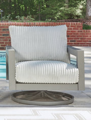 Hurley Park outdoor swivel chair with cushion by Ashley Furniture, featuring a stylish design and comfortable seating for outdoor lounging.