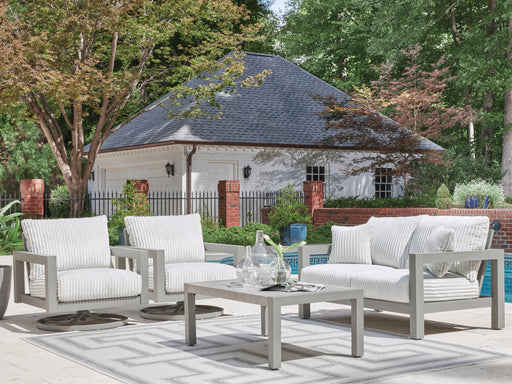 Ashley Furniture Hurley Park outdoor table set with a sturdy table and matching chairs, perfect for outdoor dining and gatherings.