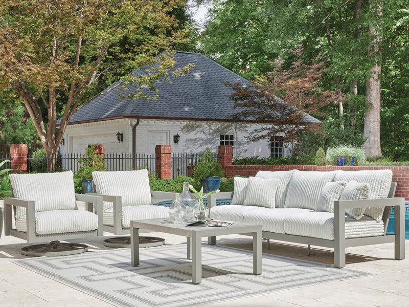 Ashley Furniture Hurley Park outdoor table set with a rectangular wooden table and matching chairs in a garden setting