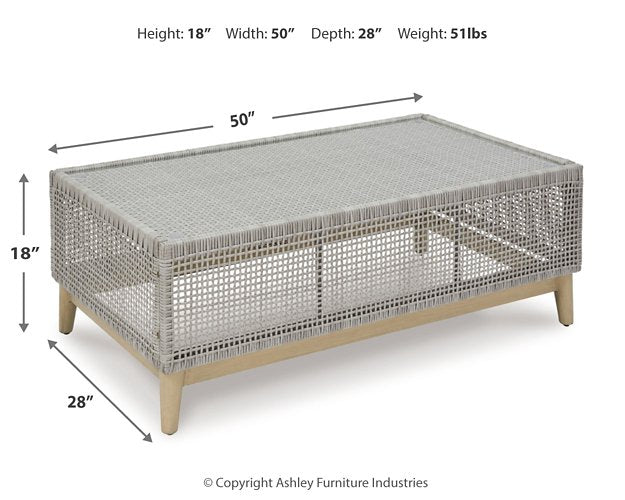 Seton Creek outdoor seating set by Ashley Furniture with cushioned chairs and a matching table for patio relaxation.