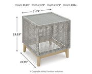 Seton Creek outdoor seating set by Ashley Furniture with cushioned chairs and a matching table for patio relaxation.