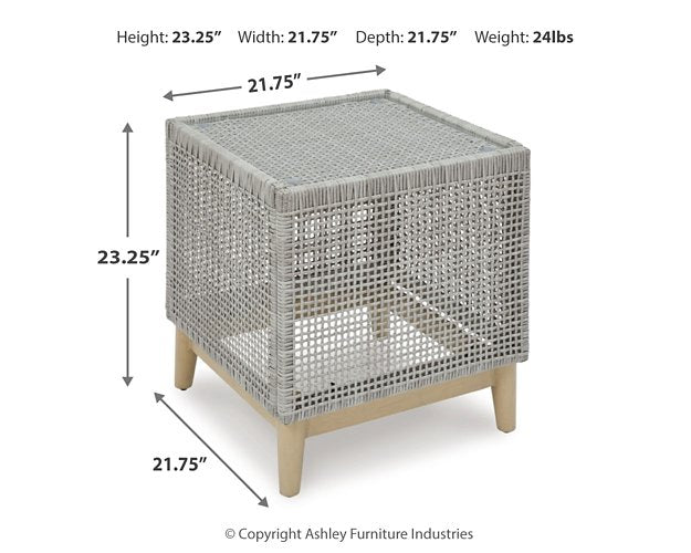 Seton Creek outdoor seating set by Ashley Furniture with cushioned chairs and a matching table for patio relaxation.