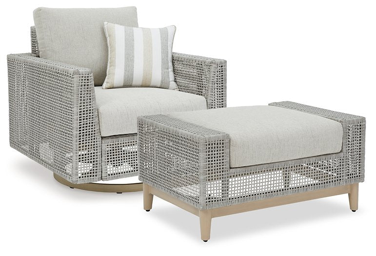 Seton Creek outdoor seating set by Ashley Furniture with cushioned chairs and a matching table for patio relaxation.